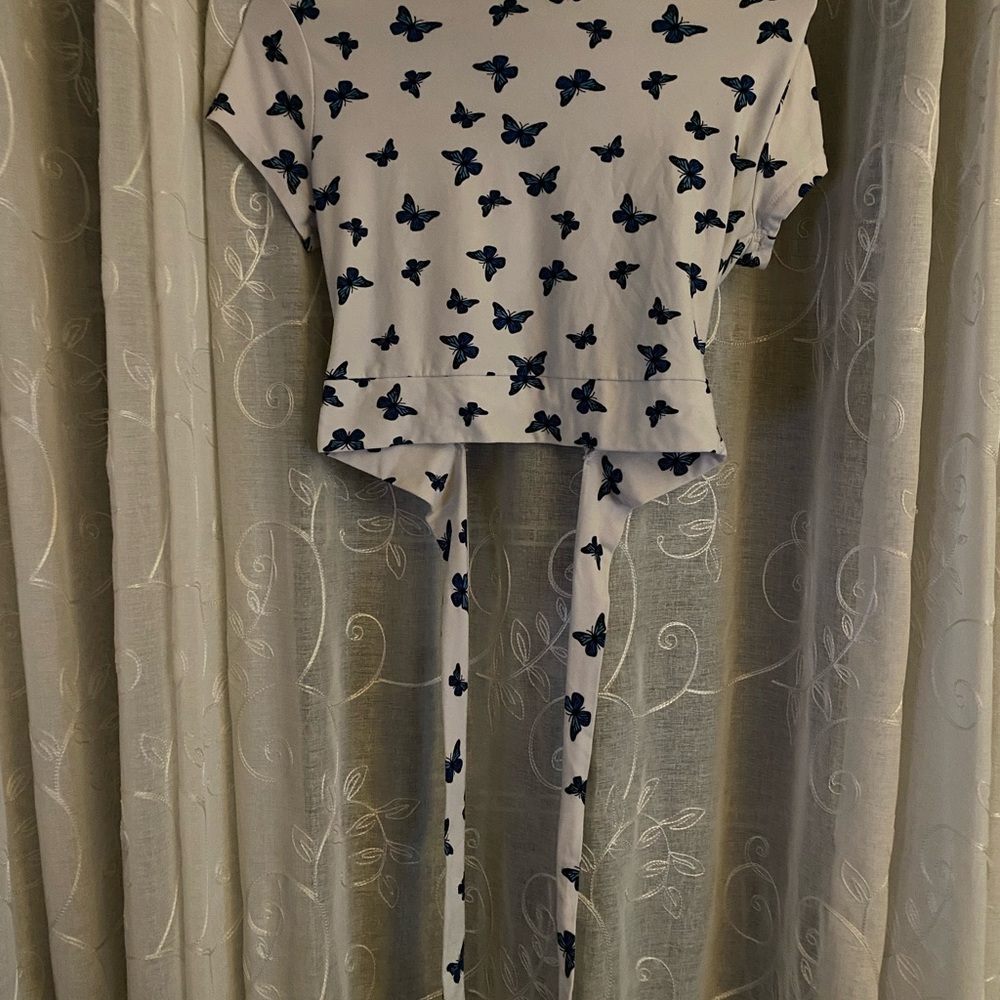 Cropped, blue butterfly criss cross tie-back shirt